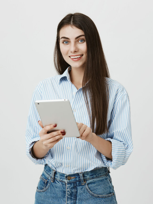 cropped-attractive-smiling-dark-haired-woman-using-digital-tablet-scaled-1.jpg