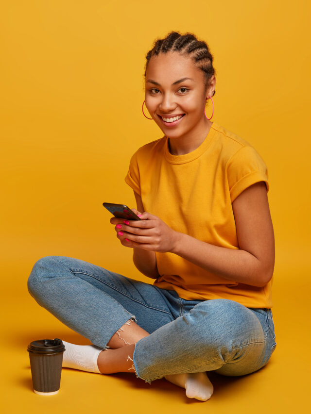 cropped-close-up-attractive-carefree-young-woman-sitting-floor.jpg