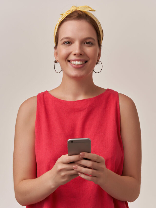 cropped-woman-wearing-stylish-trendy-red-dress-yellow-bandana-with-natural-makeup-earrings-posing-wall-looking-you-happy-smiling-face-scaled-1.jpg