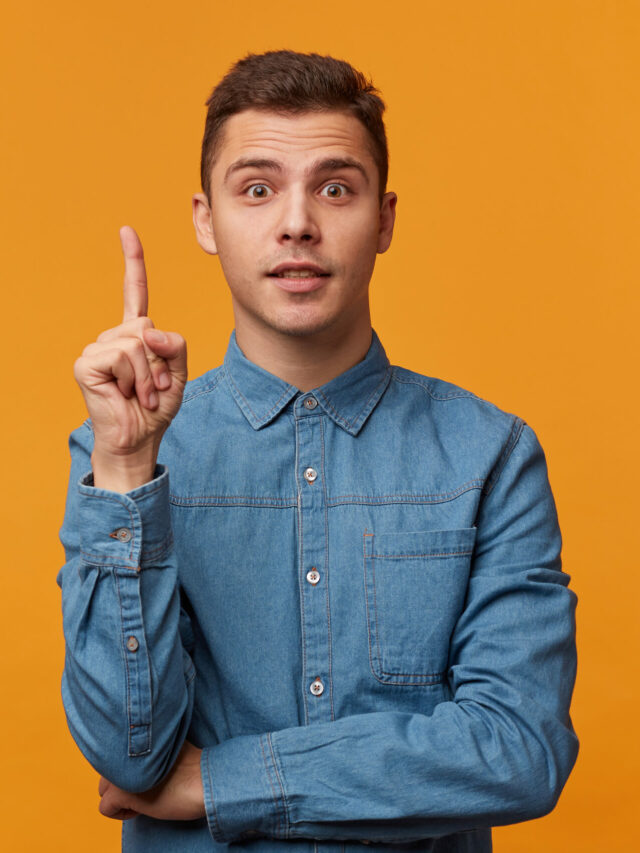 cropped-young-man-trendy-denim-shirt-looks-inspired-holds-his-index-finger-upwards-looking-front-1-scaled-1.jpg