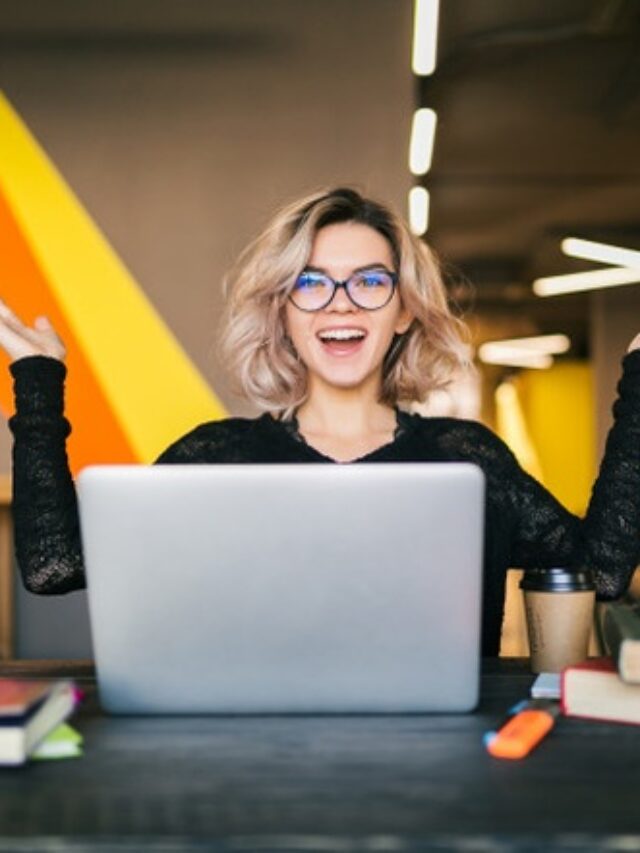 cropped-funny-happy-excited-young-pretty-woman-sitting-table-black-shirt-working-laptop-co-working-office-wearing-glasses_285396-86.jpg